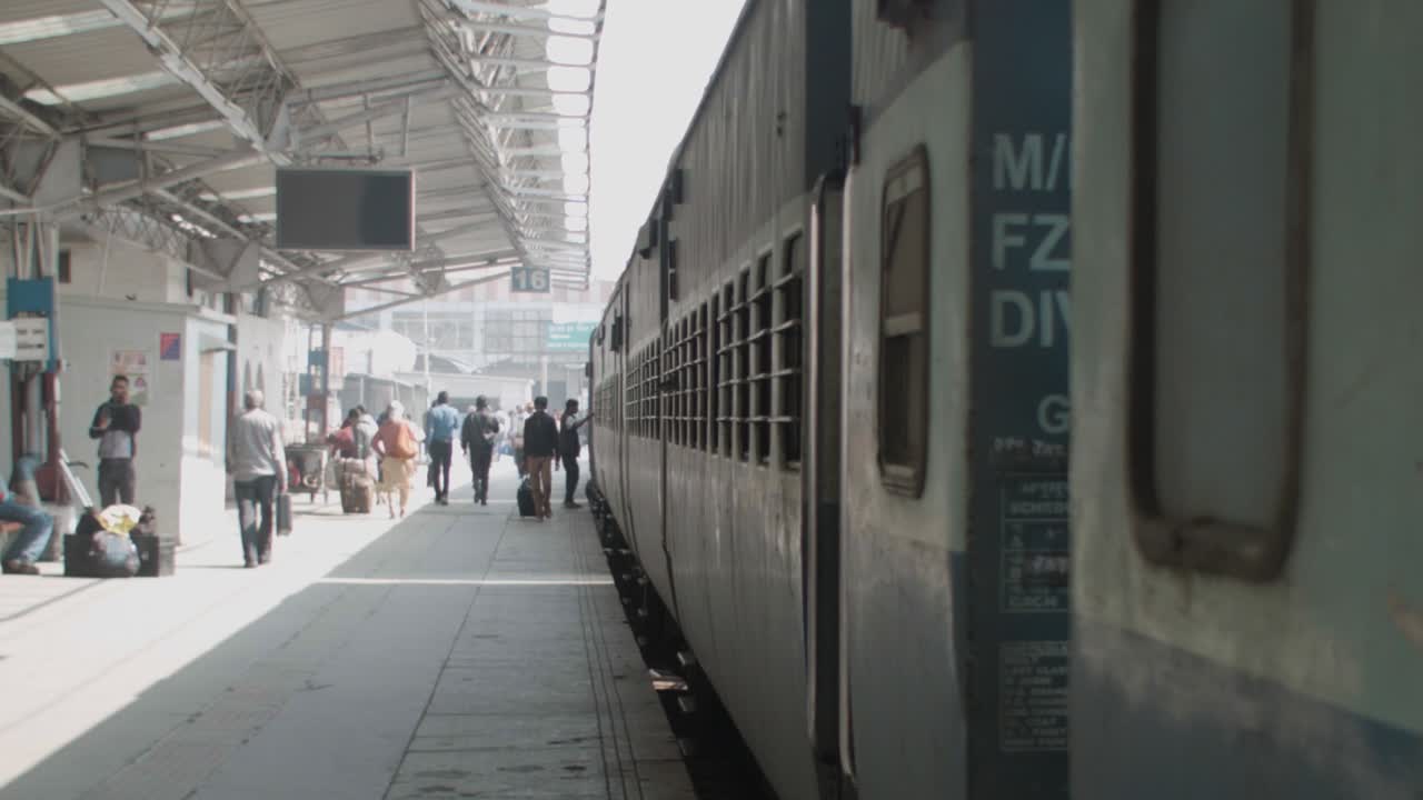 A bird lands on the train window at an  train station in Jodhpur India