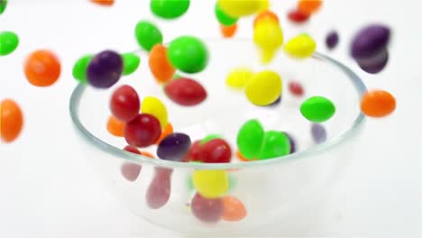 candy dropping into bowl slow motion