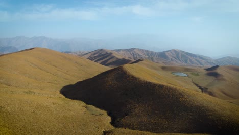 beautiful grass covered mountain landscape of the arashan mountains in kyrgyzstan -aerial