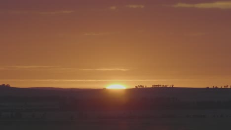 sunrise over rolling hills