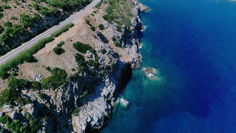 a shot from a drone of a road on the coast of the greek island of crete