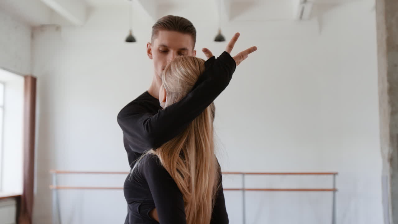 Dancers practicing in a bright studio
