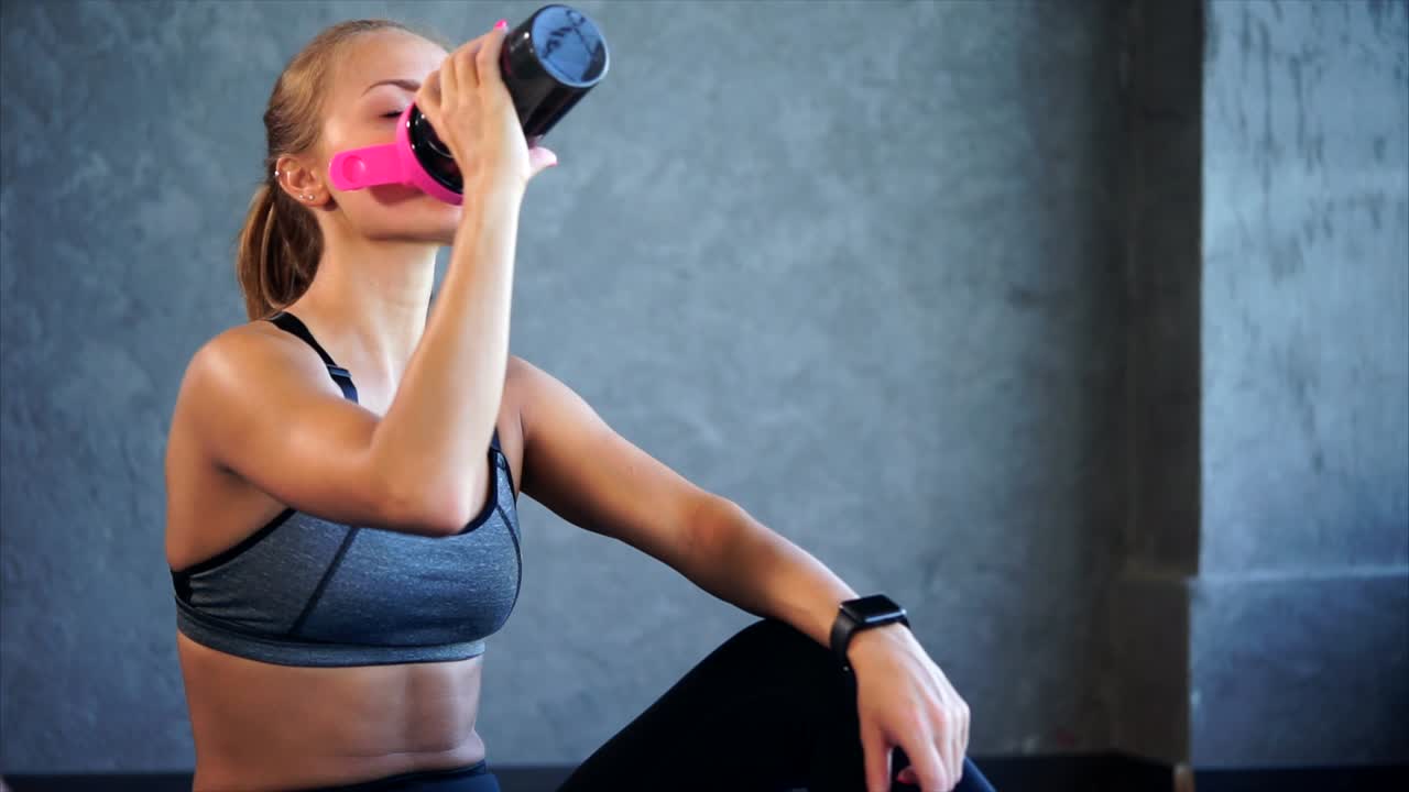Woman Taking a Protein Shake Break