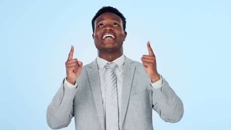 Pointing-up,-face-or-happy-businessman-in-studio