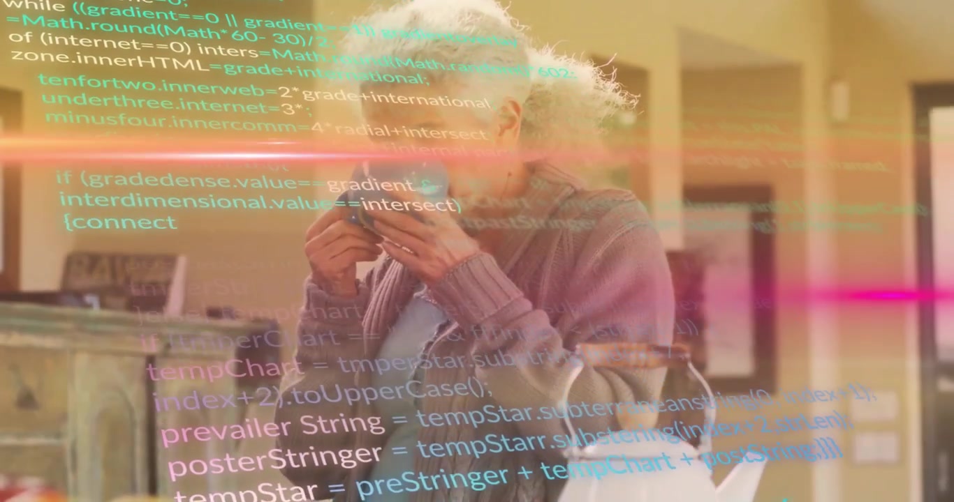 Mature woman sipping mug in kitchen causing code overlays, light streaks and scrolling tech updates
