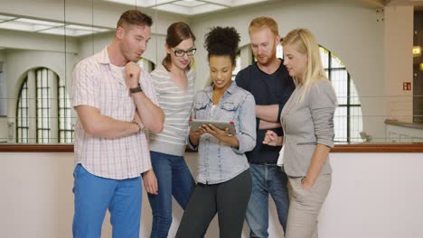 colleagues posing with tablet