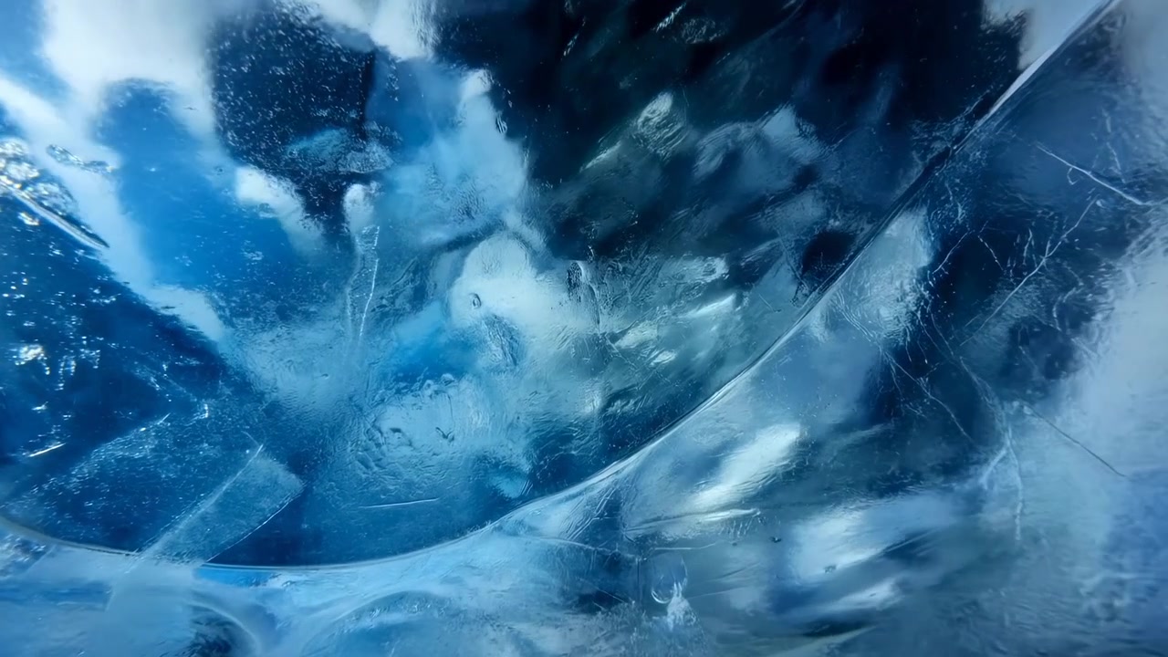 a wide-angle shot captures the serene frozen landscape adorned with striking blue and white ice formations in a cold winter scene. This natural background is commercial and design.