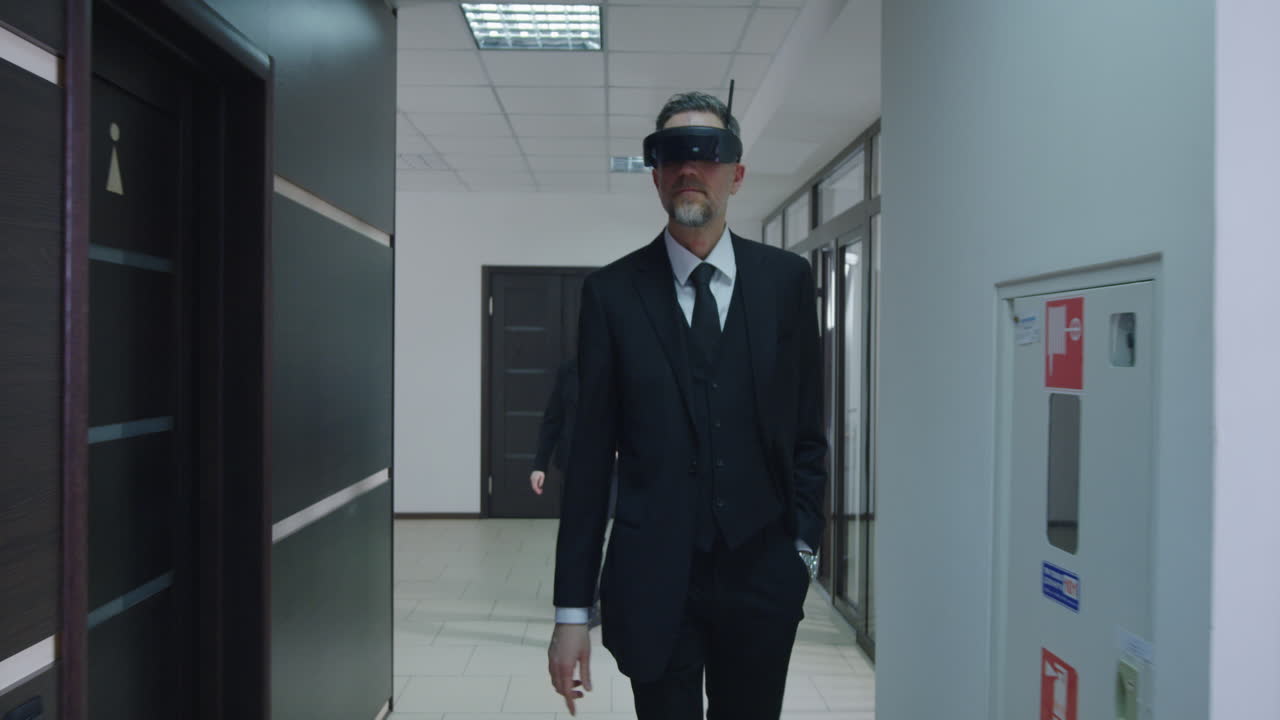 Businessman in VR Headset in Office Corridor