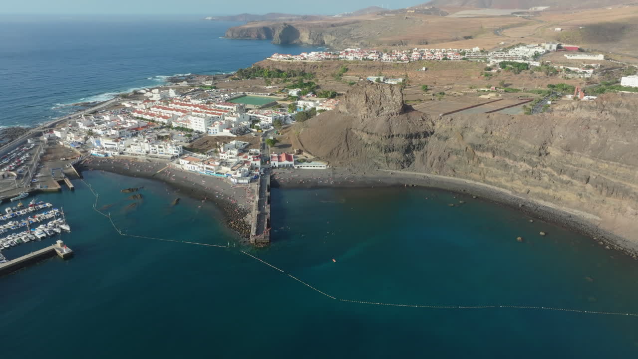 Beautiful coastal town of Puerto de las Nieves with its white houses and volcanic landscape. Agaete, Canary Islands