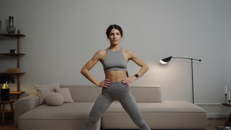 woman doing yoga and stretching at home