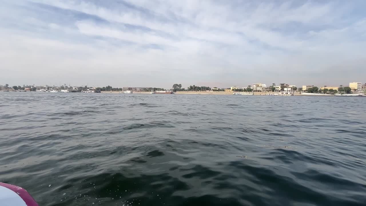 A view of a city overlooking on Nile, close up shot, trucking shot