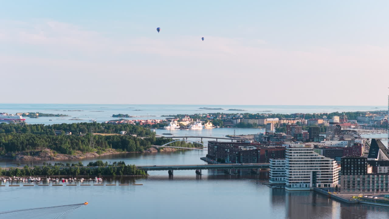 Aerial view backwards over the Vanhankaupunginselka, sunset in Kalasatama, Helsinki