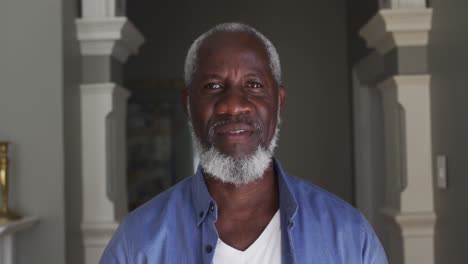 portrait of african american senior man smiling at home