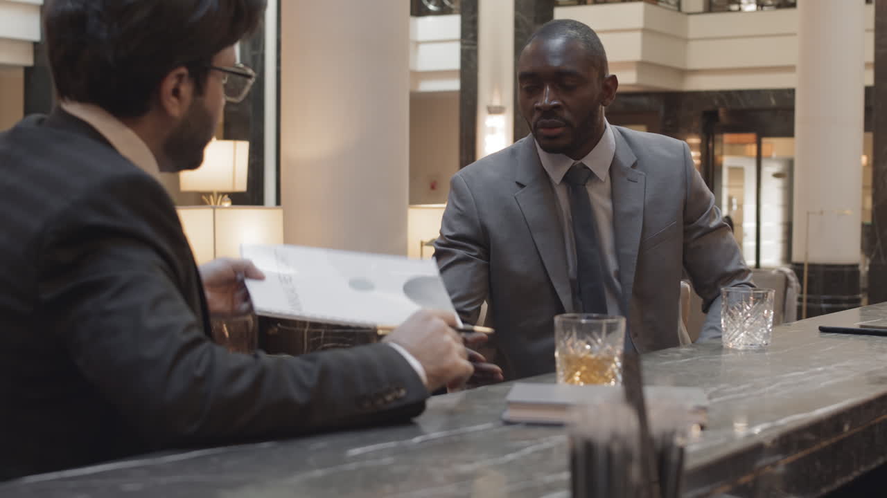 Colleagues Working and Drinking in Bar