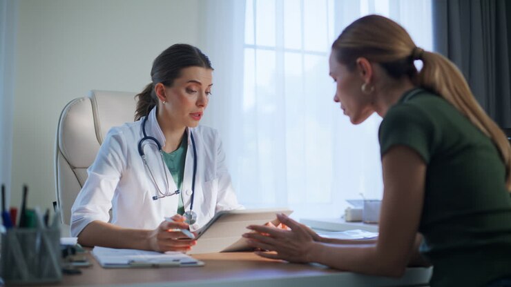 Medic showing tablet tests result explaining diagnosis patient in clinic closeup