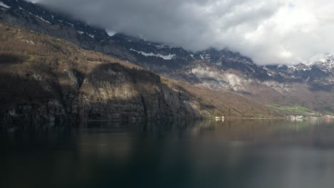 Drone-Shot-Of-High-rise-Mountains-On-Walensee-Unterterzen-Lake-In-Switzerland