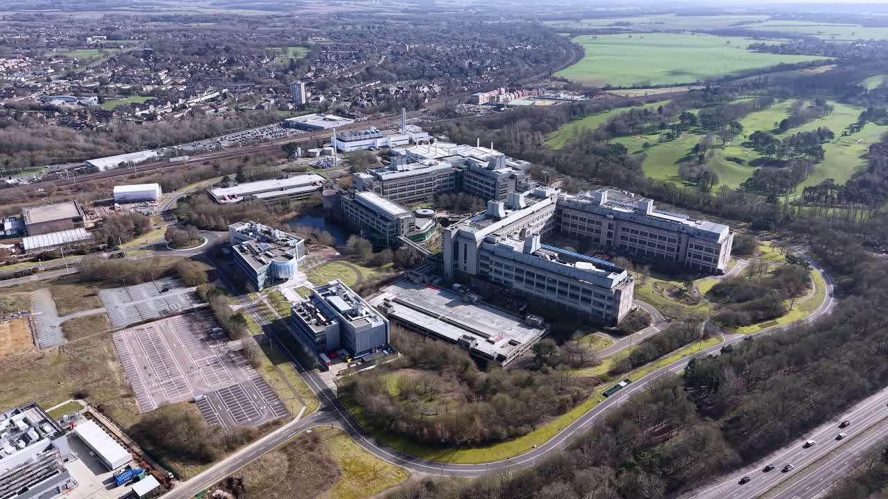 GSK aerial view over Stevenage industrial biopharma factory surrounded by vast British countryside