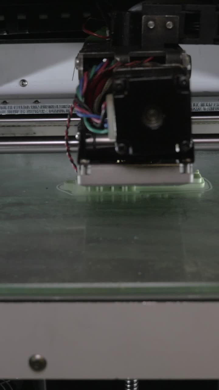 Close-up of a 3D Printer Manufacturing a Plastic Object