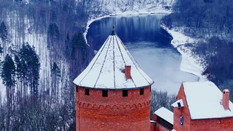 magical snowy aerial panorama over medieval turaida castle and river valley