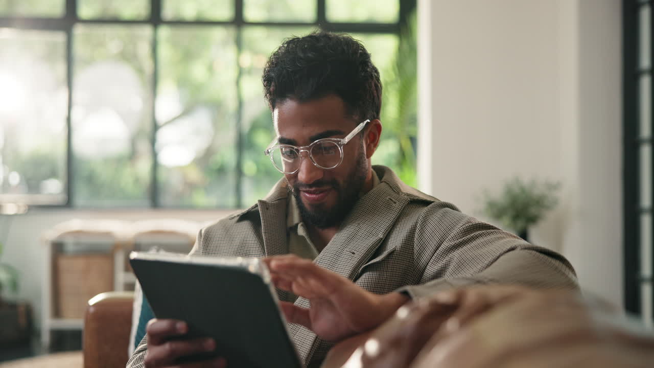 Man using tablet at home