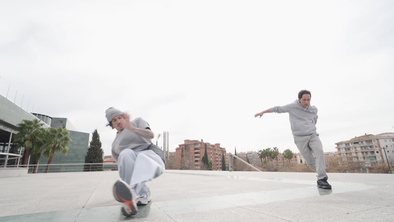 Breakdancers performing in urban environment