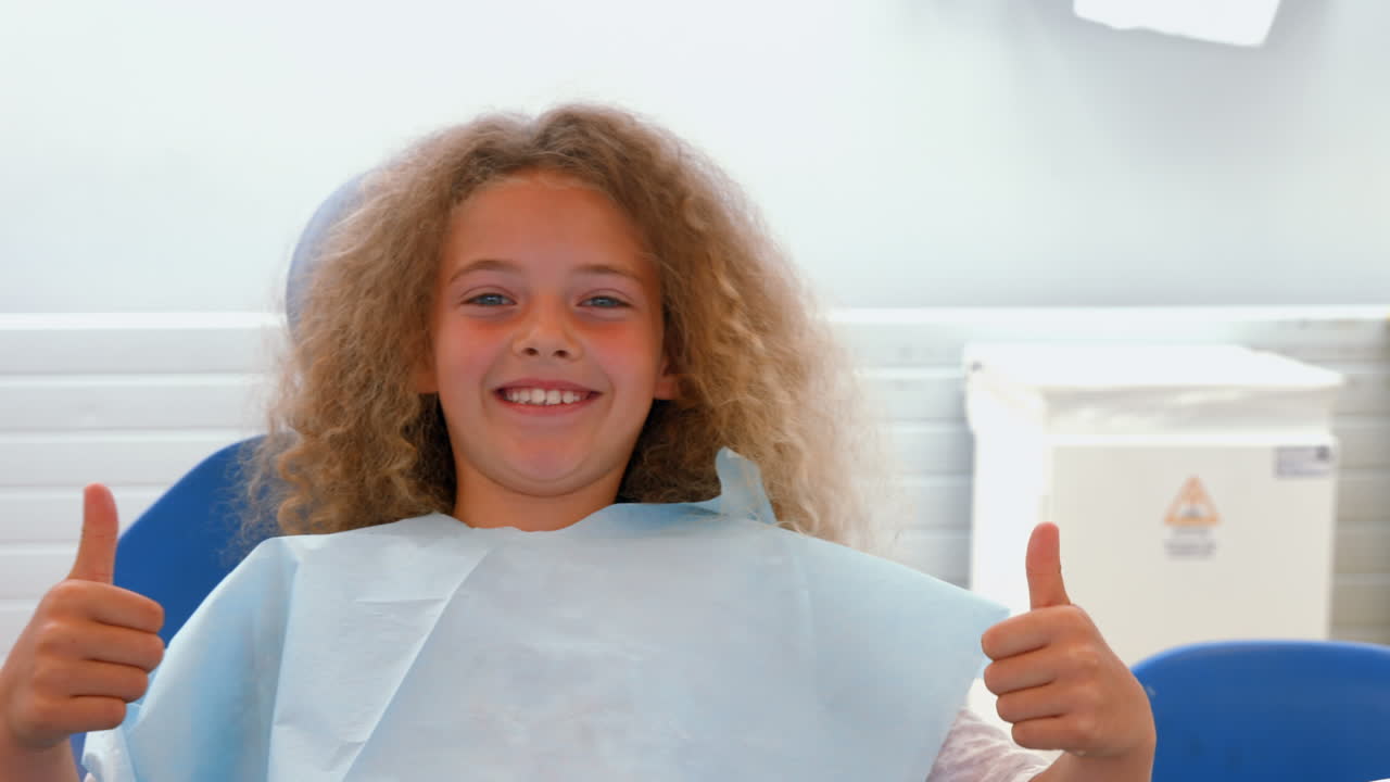 Smiling young girl sitting down