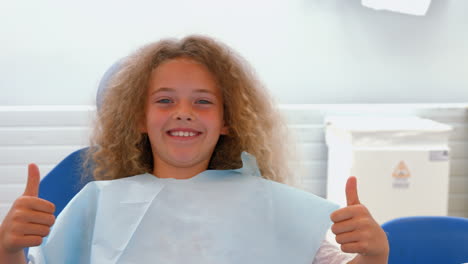 Smiling-young-girl-sitting-down