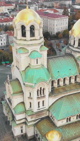aerial view of the magnificent green domes of st. alexander nevsky cathedral in sofia, bulgaria. vertical video