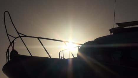 Rotating-shot-of-a-ship's-bow-at-sunset