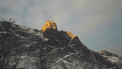 rocky mountains of andalsnes in fjord norway in europe on a gloomy day in winter - panning wide shot