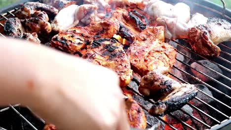 cooking meat on a charcoal barbecue