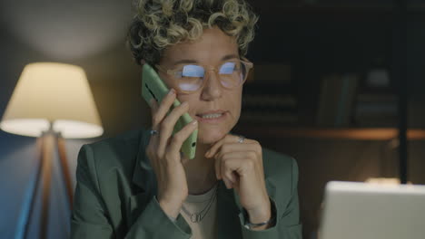 woman on phone in home office