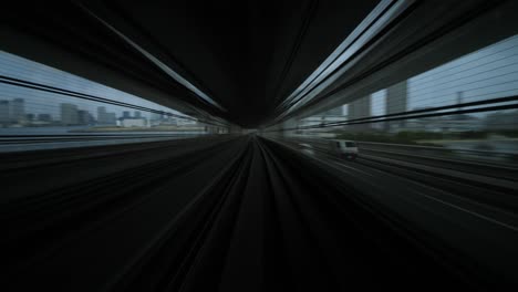 modern mass transit system at japan, view back from cabin to elevated track