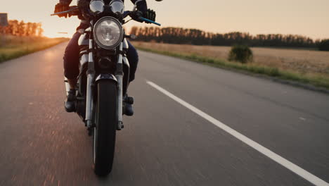 A-motorcyclist-rides-a-motorcycle-before-sunset-4