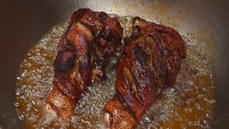 already turned and still cooking the underside, golden brown fried meat inviting to a lovely meal