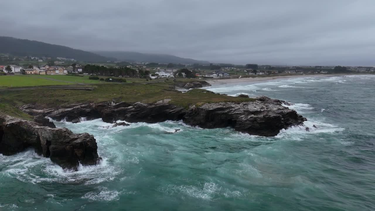 Slow motion waves breaking on beach As Catedrais , Cathedrals beach Northern Spain drone,aerial