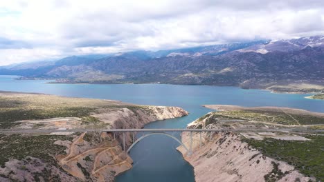 highway bridge on maslenica, croatia, dalmatian landscape at daytime - aerial drone shot