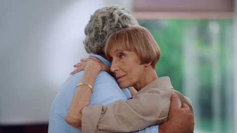 Senior-woman-and-man-enjoying-slow-dance.-Wife-hugging-husband-during-dance