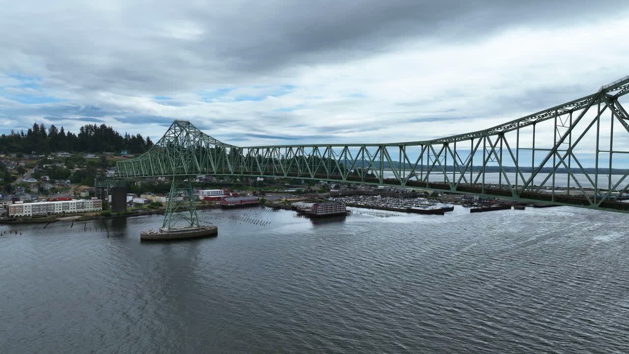 Aerial view following the Astoria-Megler Bridge, gloomy day in Oregon, USA