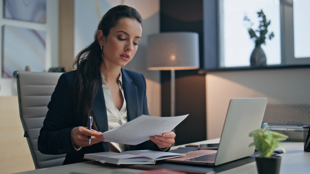 Woman manager typing laptop at office closeup. Lady examining documents writing