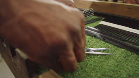 hands of barber putting shears on dressing table