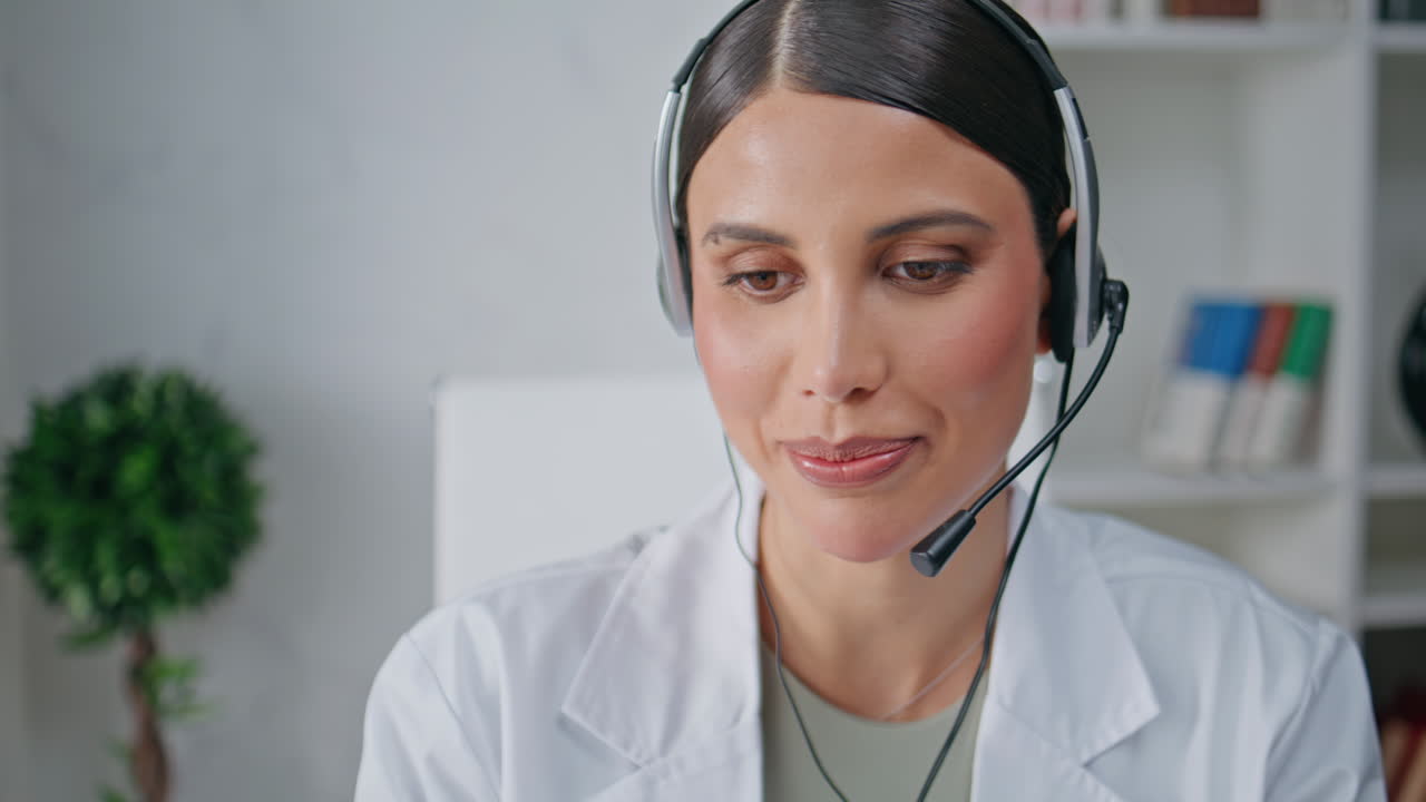 Medical consultant headset speaking at remote consultation in polyclinic closeup