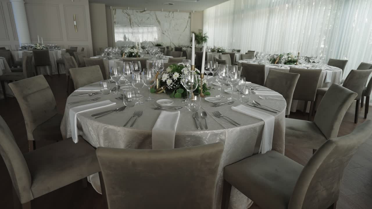 luxury wedding reception table with floral centerpiece and glassware set for celebration