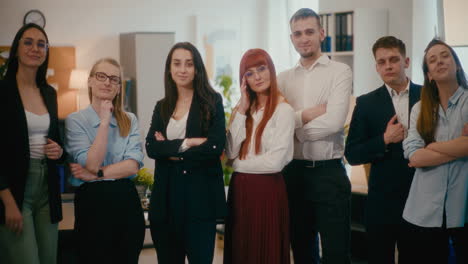 confident employees standing together in office.