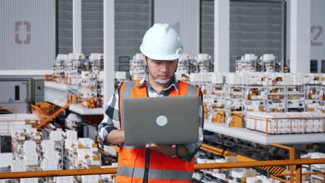 warehouse worker using a laptop