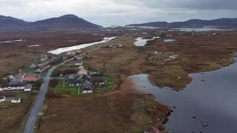 Drone-shot-of-the-main-road-towards-Lochboisdale-in-South-Uist,-part-of-the-Outer-Hebrides-of-Scotland