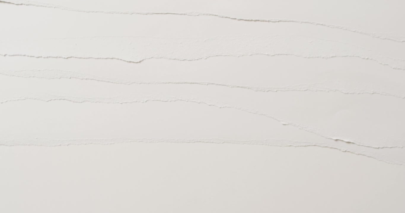 Video of close up of layers of white paper on white background
