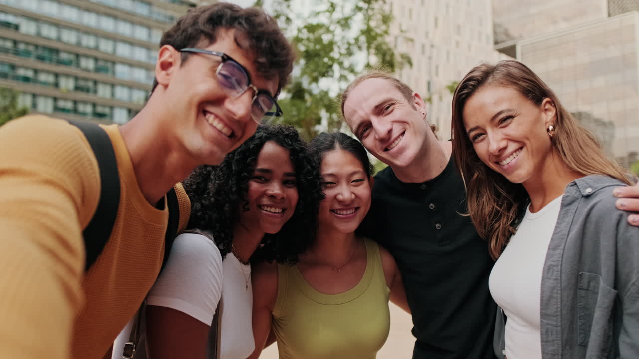 A group of young student people smiling, gesturing and looking at camera