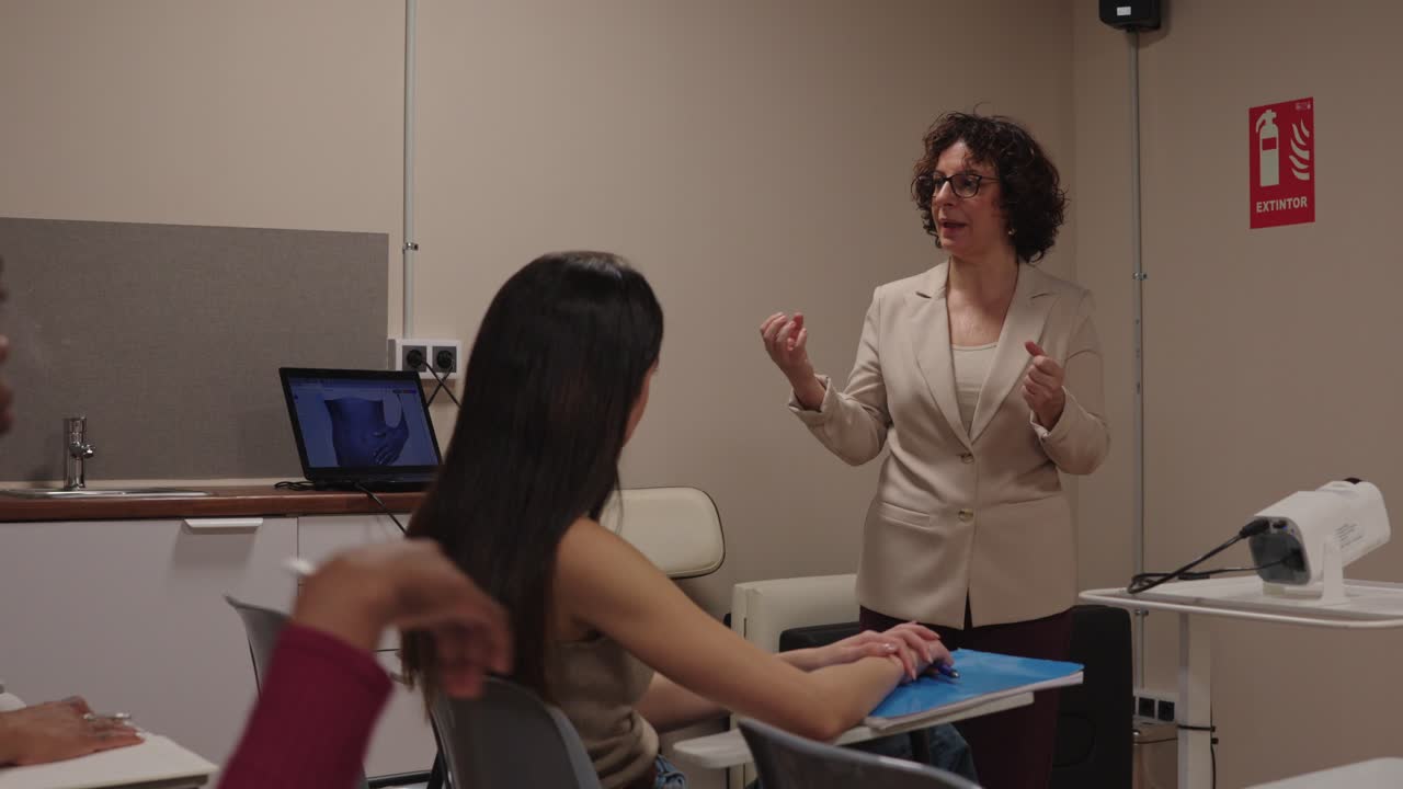 Classroom scene with a teacher lecturing students
