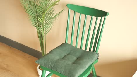 green chair with plant decor